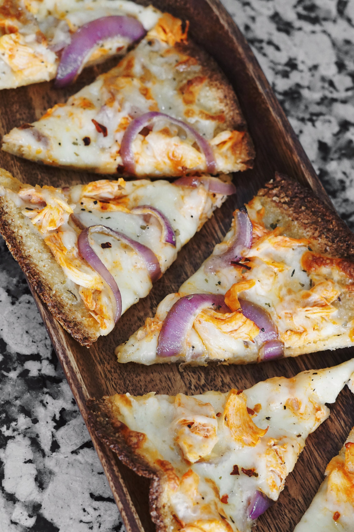Jenna Boron of Life and Personal Style blog, Balance and Chaos, shares a Low Carb Buffalo Chicken Pizza recipe using Trader Joe's Cauliflower Pizza Crust
