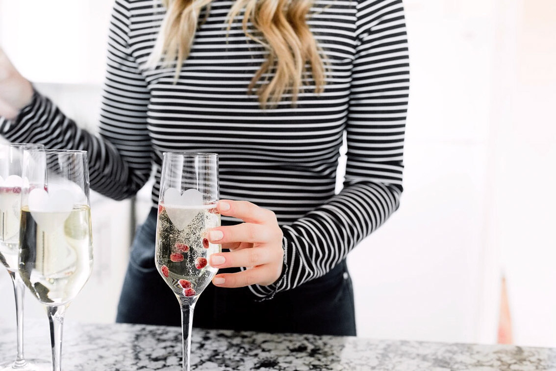 Jenna Boron of life and personal style blog, Balance and Chaos, shares a William's Sonoma Valentine's / Galentine's Day pink glitter donut recipe & Prosecco