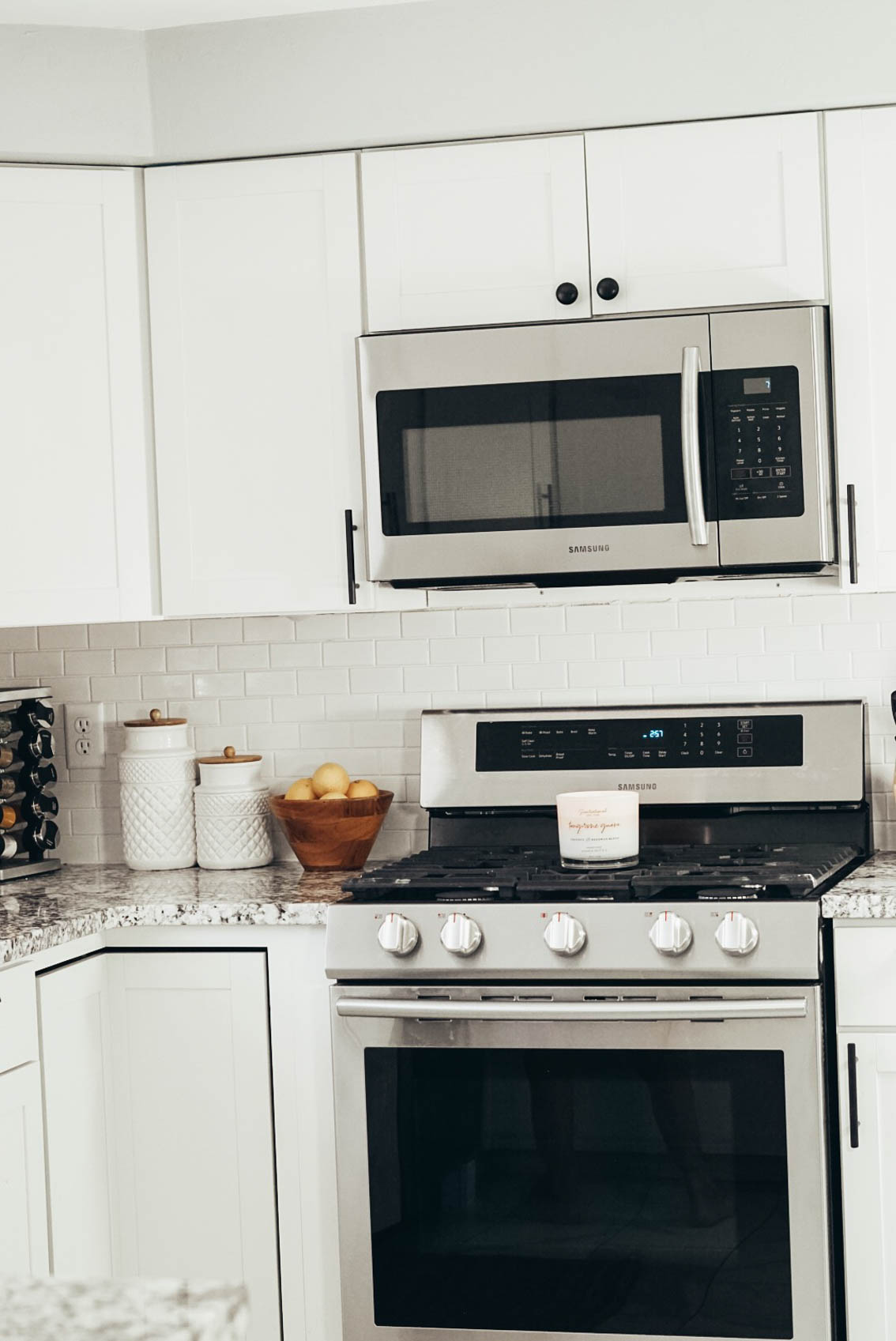 Stainless steel appliances white kitchen