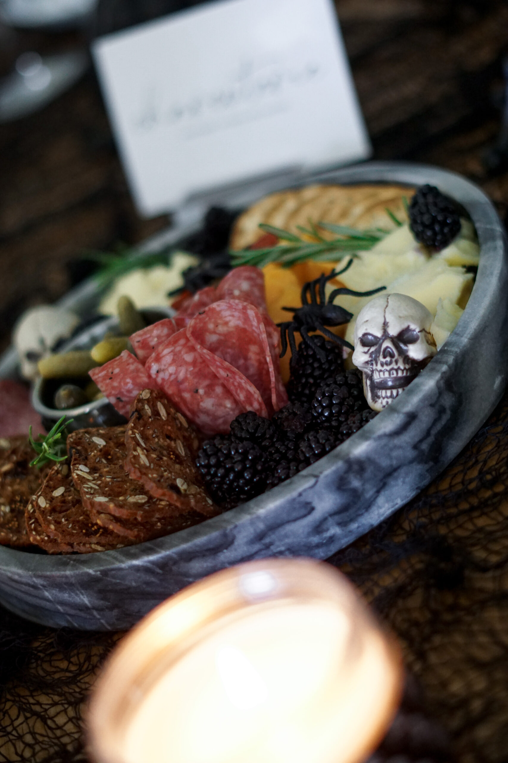 halloween charcuterie board with skulls and spiders
